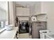 Laundry room featuring front-load washer and dryer, plus ample storage at 709 S Himes Ave, Tampa, FL 33609