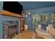 Living room featuring a fireplace, wood floors, modern furniture, and access to the patio at 709 S Himes Ave, Tampa, FL 33609