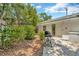 Private patio area ideal for grilling and entertaining, surrounded by established landscaping at 709 S Himes Ave, Tampa, FL 33609