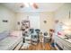 Bedroom with hardwood floors, ceiling fan, and abundant natural light at 9307 N Oakleaf Ave, Tampa, FL 33612