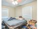 Bedroom with two windows allowing natural light and hardwood floors at 9307 N Oakleaf Ave, Tampa, FL 33612