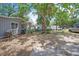 Exterior view of house from the side of a house, with trees at 9307 N Oakleaf Ave, Tampa, FL 33612