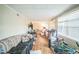 Living room showing hardwood floors, windows and casual furniture at 9307 N Oakleaf Ave, Tampa, FL 33612