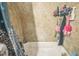 Shower and tub with tiled wall and bath products in convenient wall rack at 9307 N Oakleaf Ave, Tampa, FL 33612