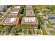 A high-angle aerial view showcasing the well-maintained roofs and landscaping of multiple townhouses at 5016 W Lancaster St # 00, Tampa, FL 33616