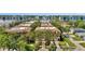 A wide aerial view of multi-Gathering homes featuring manicured landscaping, and street access at 5016 W Lancaster St # 00, Tampa, FL 33616