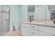 Bathroom featuring updated vanity with bright countertop and a glass enclosed shower at 5016 W Lancaster St # 00, Tampa, FL 33616