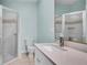 Clean and modern bathroom with a glass shower and vanity at 5016 W Lancaster St # 00, Tampa, FL 33616