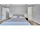 Relaxing bedroom with calm colors, bedside lamps and two entryways at 5016 W Lancaster St # 00, Tampa, FL 33616