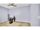 Bedroom with a ceiling fan and carpet flooring, creating a comfortable space at 5016 W Lancaster St # 00, Tampa, FL 33616