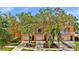 Inviting townhouse exterior with a white fenced balcony, a one car garage and neat landscaping at 5016 W Lancaster St # 00, Tampa, FL 33616