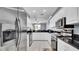 Spacious kitchen featuring stainless steel appliances, granite countertops, and ample cabinet space at 5016 W Lancaster St # 00, Tampa, FL 33616