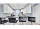 Modern kitchen featuring granite countertops, stainless steel appliances, and stylish bar stool seating at 5016 W Lancaster St # 00, Tampa, FL 33616