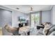 Comfortable living space with a modern design and sliding door to the balcony at 5016 W Lancaster St # 00, Tampa, FL 33616