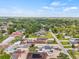 A birds-eye view of a home, illustrating its place within a verdant neighborhood setting and community layout at 10227 Parsons St, Tampa, FL 33615