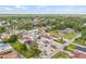 Overhead image displays a property nestled in a neighborhood with mature trees and well-maintained landscapes at 10227 Parsons St, Tampa, FL 33615
