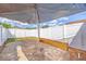 Backyard featuring brick-paved area, partial shade, and white fence at 10227 Parsons St, Tampa, FL 33615