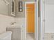 The bathroom features updated fixtures, including tile floors and closet at 10227 Parsons St, Tampa, FL 33615
