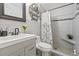 Updated bathroom featuring tile shower and modern vanity at 10227 Parsons St, Tampa, FL 33615