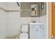 The bathroom features updated fixtures, including tile floors at 10227 Parsons St, Tampa, FL 33615