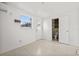 The bedroom area features tile flooring, a bathroom, and a window at 10227 Parsons St, Tampa, FL 33615