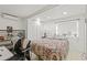 Well-lit bedroom featuring a comfortable bed, closet and window at 10227 Parsons St, Tampa, FL 33615