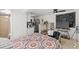 Bright bedroom with a partial kitchen view, ceiling fan, and comfortable furnishings at 10227 Parsons St, Tampa, FL 33615