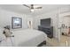 Comfortable bedroom with large TV, dresser, and walk-in closet at 10227 Parsons St, Tampa, FL 33615