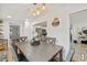 Cozy dining room with stylish lighting fixture and access to laundry at 10227 Parsons St, Tampa, FL 33615