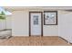 The exterior shows a door, window, and brick floor at 10227 Parsons St, Tampa, FL 33615