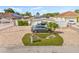 Charming single-story home featuring a brick paved driveway and mature landscaping at 10227 Parsons St, Tampa, FL 33615
