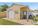 A detached garage features a roll up door and side entrance at 10227 Parsons St, Tampa, FL 33615