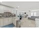 Bright, open kitchen with modern fixtures and a seamless flow to the living area at 10227 Parsons St, Tampa, FL 33615