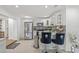 Updated kitchen with modern appliances, white cabinetry and a breakfast bar at 10227 Parsons St, Tampa, FL 33615
