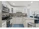 Modern kitchen featuring granite countertops, a mosaic backsplash, and ample cabinetry at 10227 Parsons St, Tampa, FL 33615