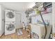 Functional laundry room with washer/dryer, utility sink and storage at 10227 Parsons St, Tampa, FL 33615