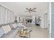 Spacious living room with lots of natural light and ceiling fan at 10227 Parsons St, Tampa, FL 33615