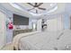 Spacious main bedroom featuring a ceiling fan, closet, and dresser at 10227 Parsons St, Tampa, FL 33615