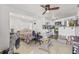 Open-concept living space with a combined living, kitchen and sleeping area featuring tile flooring and ample light at 10227 Parsons St, Tampa, FL 33615
