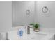 Bathroom sink area features white countertop, a modern faucet and a large mirror at 1073 Kenwood Dr, Dunedin, FL 34698