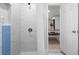 Modern bathroom features white marble tile in the shower with blue accent wall at 1073 Kenwood Dr, Dunedin, FL 34698