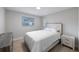 Cozy bedroom with neutral tones, a comfortable bed, and ample natural light at 1073 Kenwood Dr, Dunedin, FL 34698