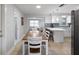 Charming dining area adjacent to the kitchen, showcasing an open-concept layout at 1073 Kenwood Dr, Dunedin, FL 34698