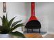Retro red fireplace in the living room showing a unique architectural focal point at 1073 Kenwood Dr, Dunedin, FL 34698