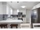 Modern kitchen features stainless appliances, white countertops and grey backsplash at 1073 Kenwood Dr, Dunedin, FL 34698