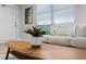 Close up of the modern living room's decor highlighting the neutral color palette and stylish accent pillows at 1073 Kenwood Dr, Dunedin, FL 34698