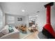 Open-concept living room with fireplace and large window provides ample natural light at 1073 Kenwood Dr, Dunedin, FL 34698