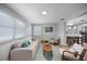 Bright living room provides ample light and has comfortable seating and decor at 1073 Kenwood Dr, Dunedin, FL 34698