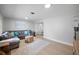 Open-concept living area with modern finishes, including light wood floors and recessed lighting at 1073 Kenwood Dr, Dunedin, FL 34698