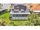 Aerial view of home with solar panels and screened in porch at 18109 Kara Ct, Tampa, FL 33647